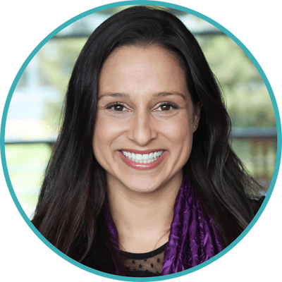 Photo of Dr. Sahar Dorani, clinical psychologist in San Francisco, CA. Sahar is an Iranian American woman with long dark hair. She is wearing a black top and a purple scarf.