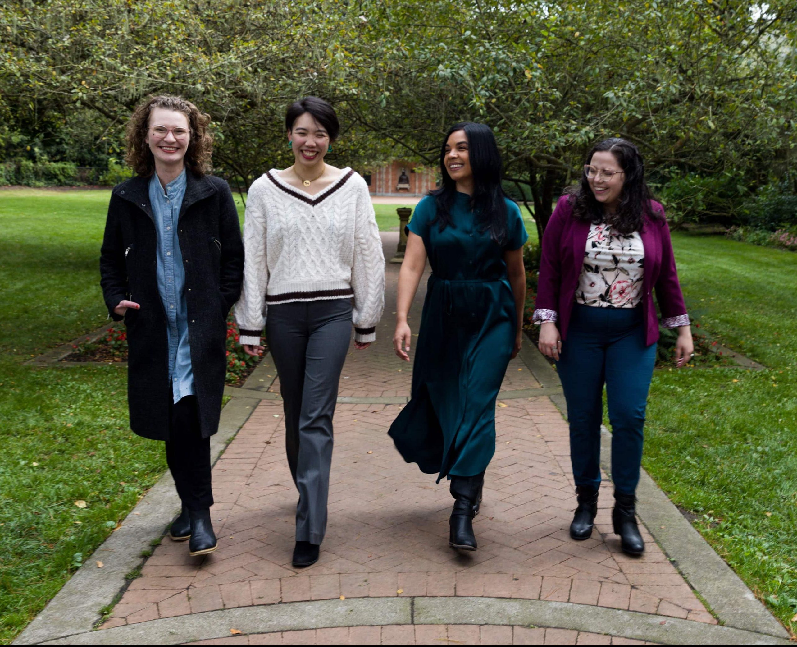 A group of San Francisco therapists walking together and chatting in Golden Gate Park.