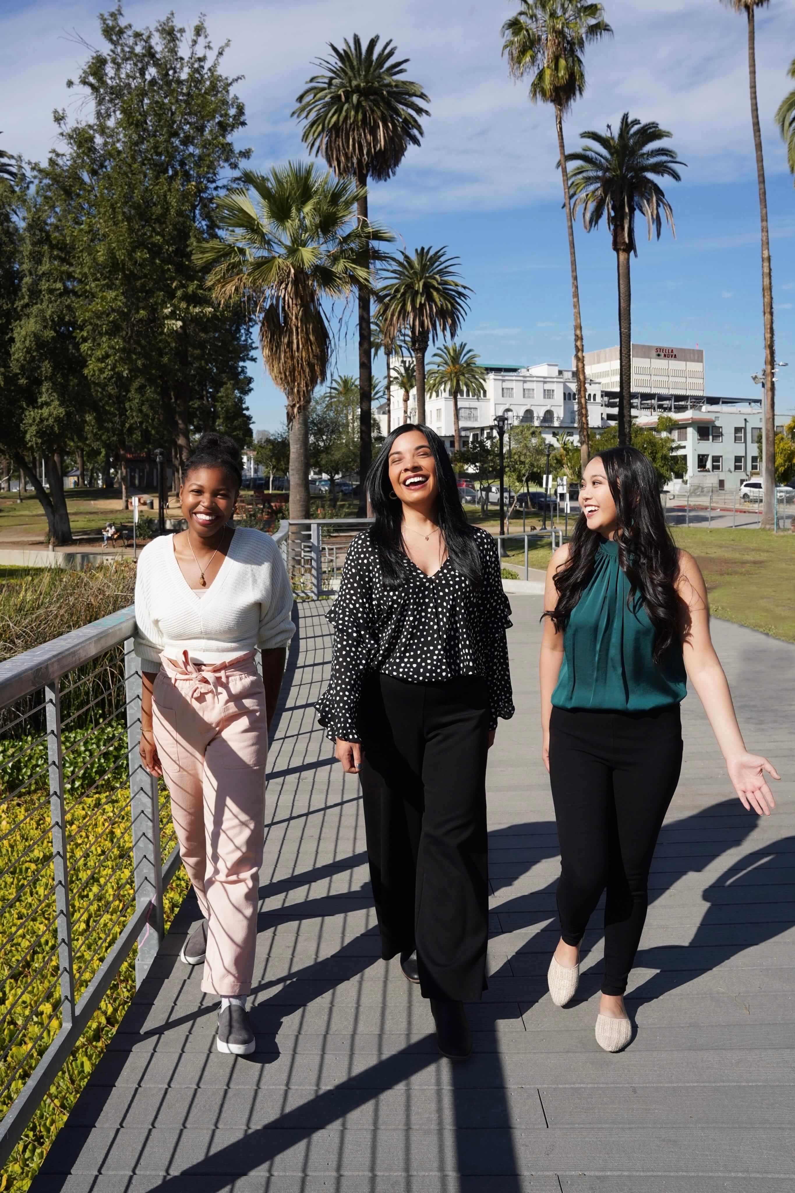 A group of Stella Nova therapists walking together in Echo Park, Los Angeles, with happy expressions on their faces.